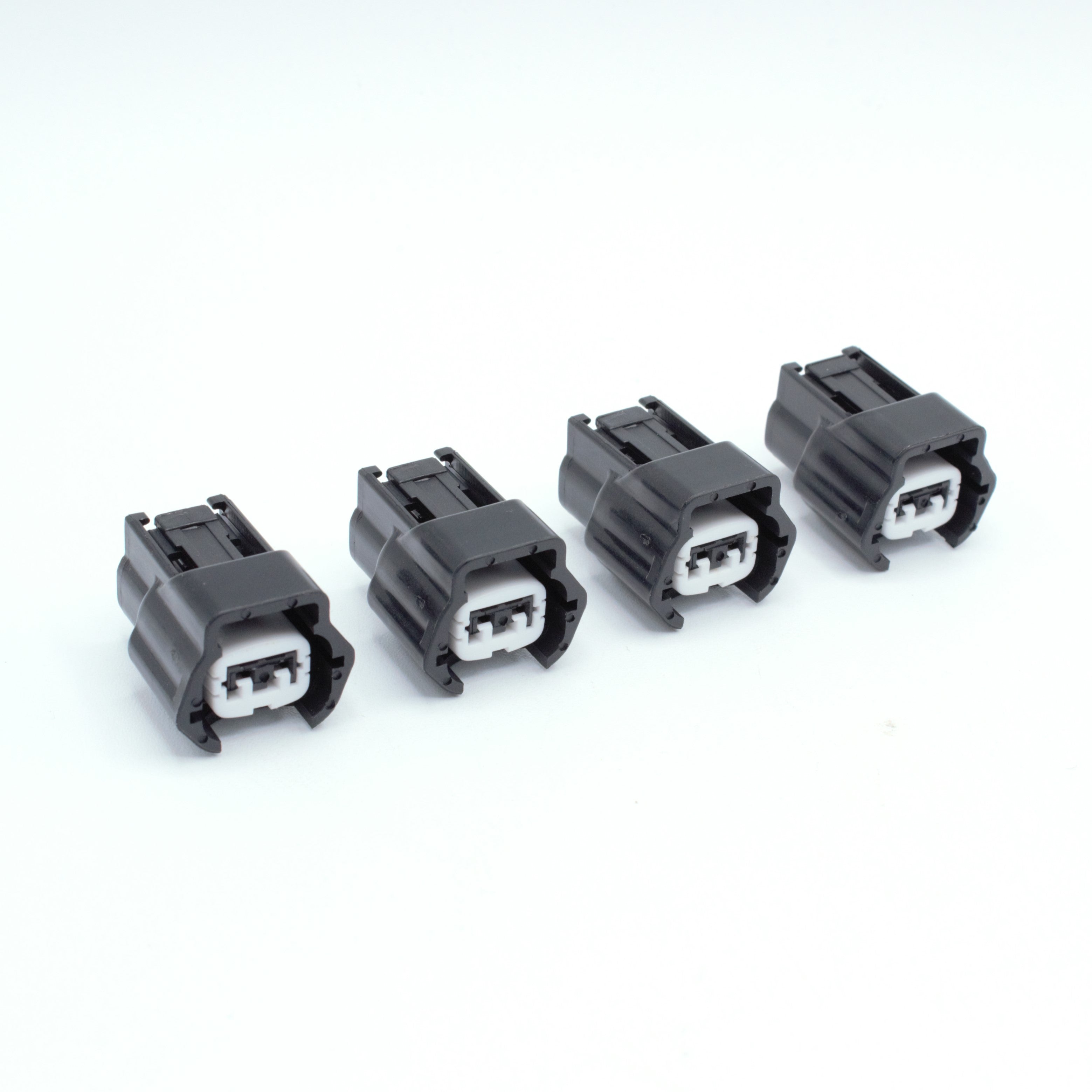Set of 4 Nissan injector connector for RB and SR engines
Black with a white TPA 
left side low key right side high key
comes with terminals and seals
Made by Sumiomo RS type E series pin way terminal, sealed
sold as a set of 4 or 6
