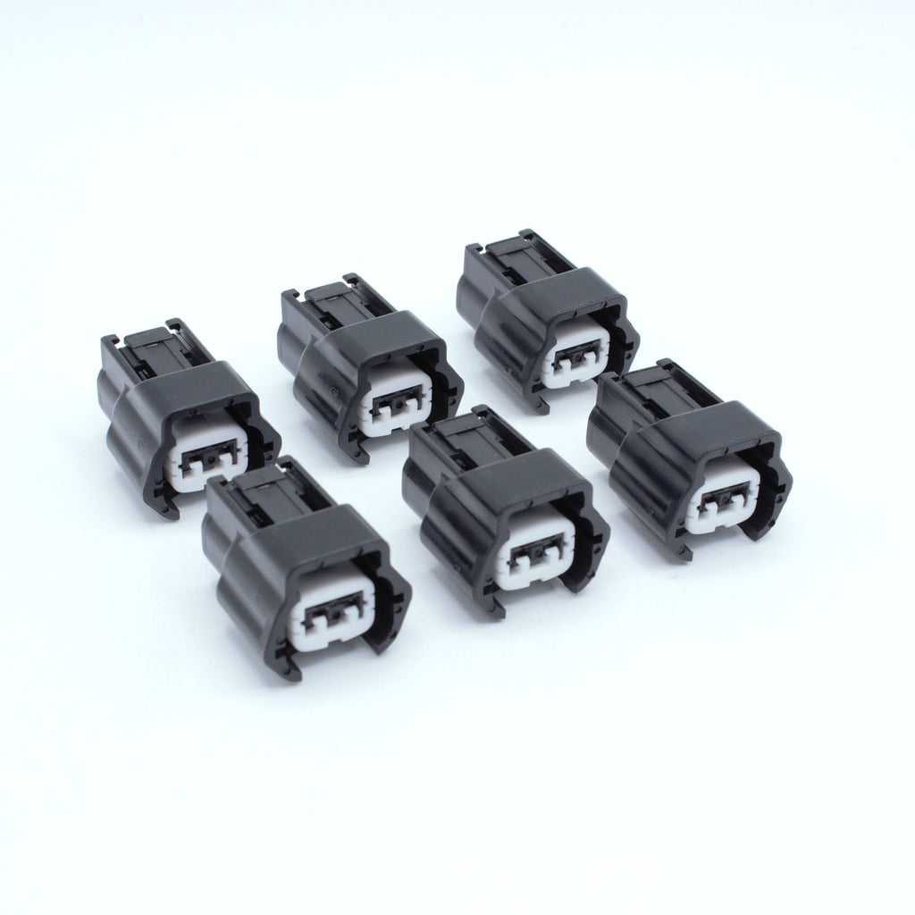 Set of 6 Nissan injector connector for RB and SR engines
Black with a white TPA 
left side low key right side high key
comes with terminals and seals
Made by Sumiomo RS type E series 2 pin way terminal, sealed
sold as a set of 4 or 6