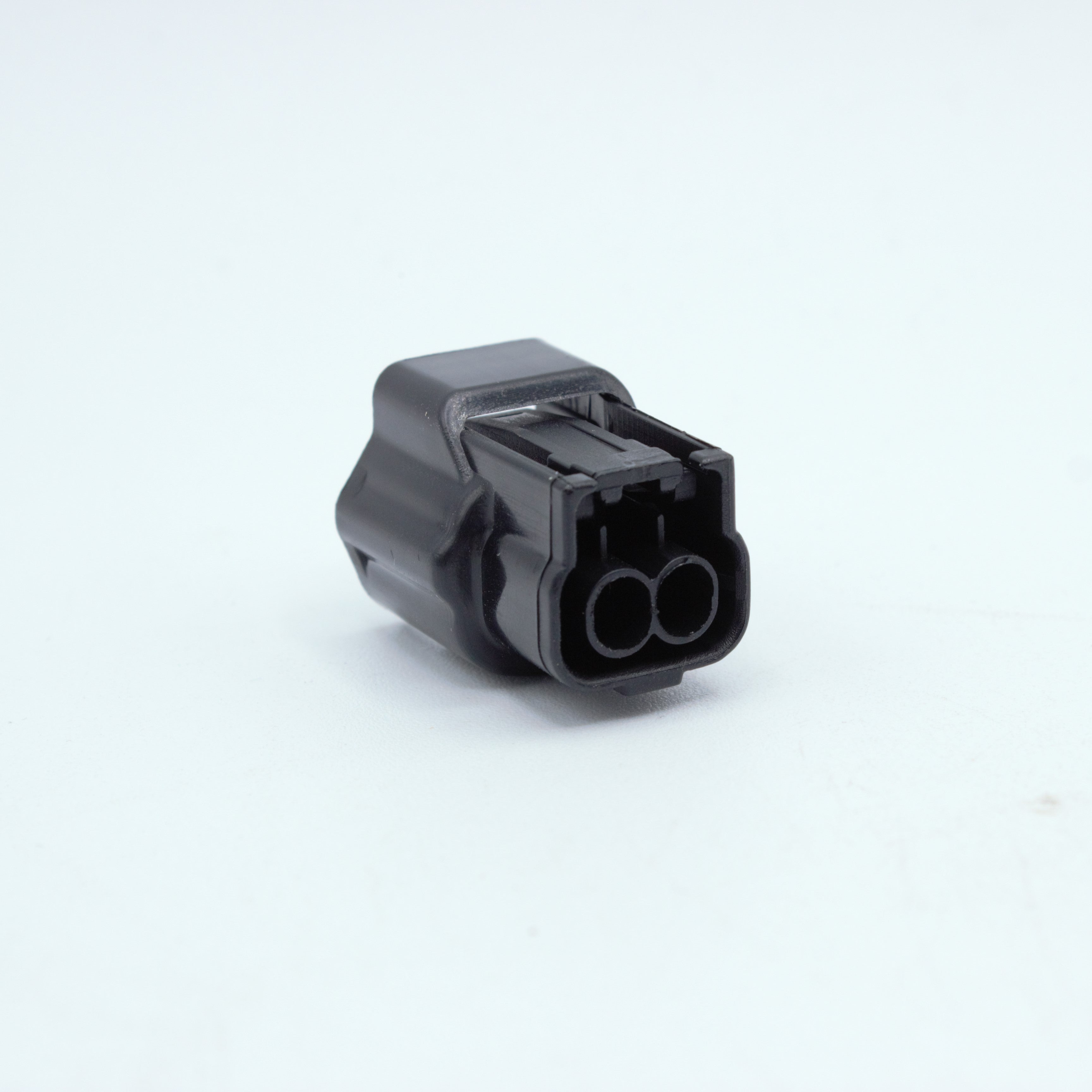 Nissan injector connector for RB and SR engines
Black with a white TPA 
left side low key right side high key
comes with terminals and seals
Made by Sumiomo RS type E series 2 pin way terminal, sealed
sold as a set of 4 or 6