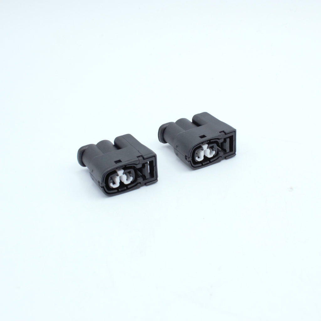 Set of 2 toyota ignition coil connectors
2 pin way terminal, sealed
Black with white TPA in center
Made by Yazaki Sumitomo 090 090II series

commonly used in UZ ignition systems with distributors and 1JZ 2JZ coils as well as 7M and other Toyota engines

sold as a set of 2, 3 or 6, comes with terminals and seals