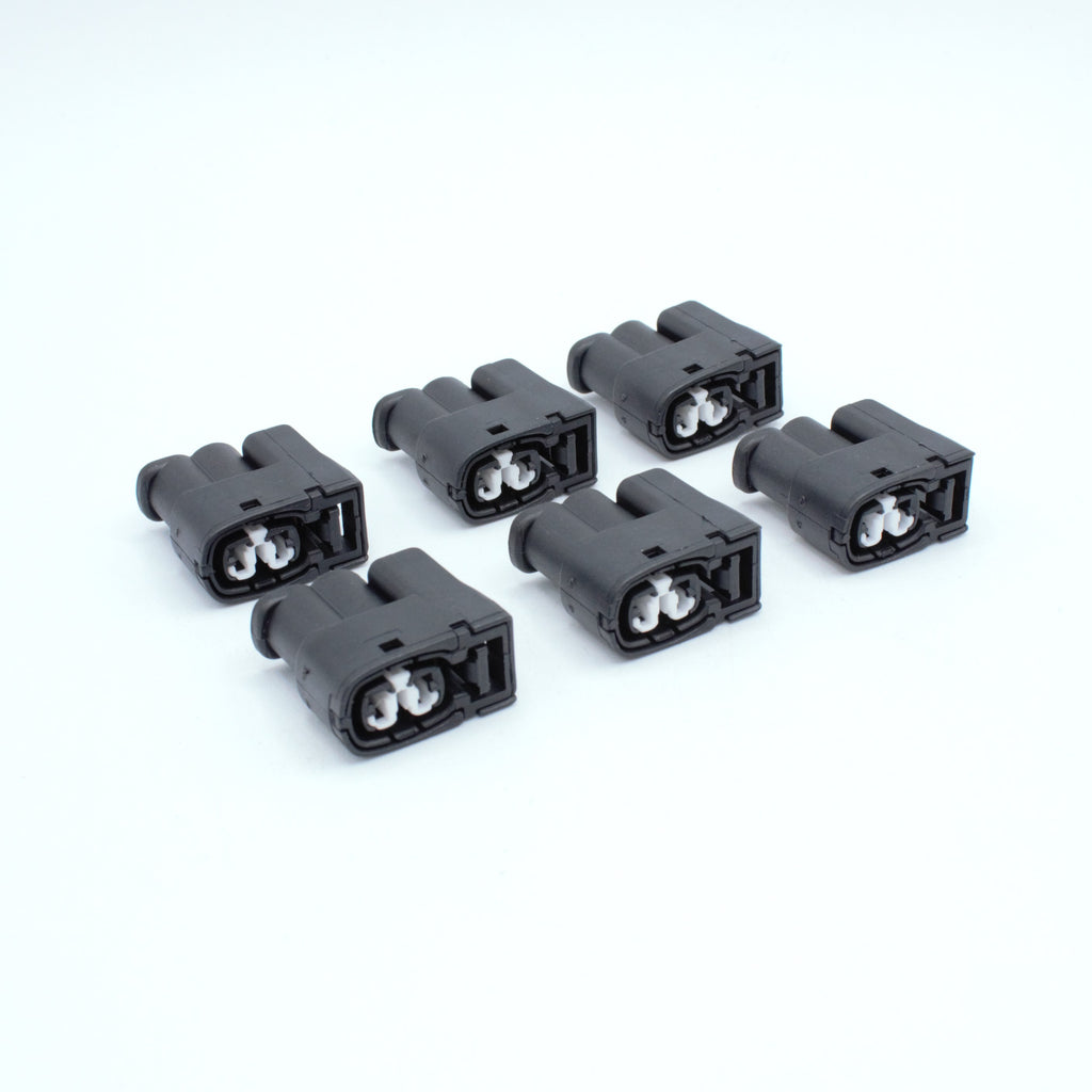 Set of 6 toyota ignition coil connectors
2 pin way terminal, sealed
Black with white TPA in center
Made by Yazaki Sumitomo 090 090II series

commonly used in UZ ignition systems with distributors and 1JZ 2JZ coils as well as 7M and other Toyota engines

sold as a set of 2, 3 or 6, comes with terminals and seals